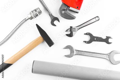 Plumber's items on white background