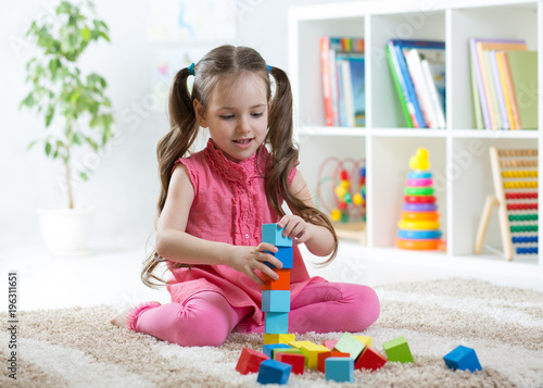 cute child girl playing wit...