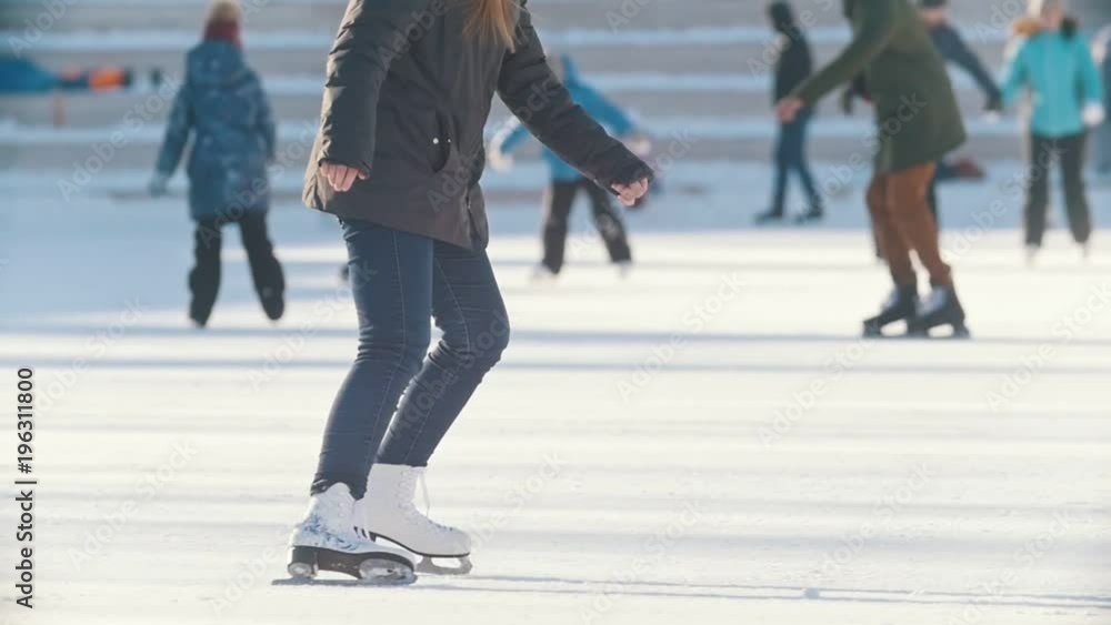 Portrait of Russian skater teen girl skillfully skating on public ice rink Portrait of Russian skater teen girl skillfully skating on public ice rink