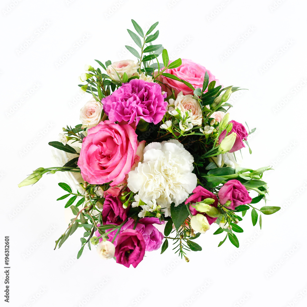 Composition of flowers in a pink hatbox. Tied with wide white ribbon and bow