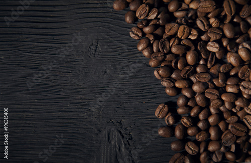 coffee beans on a black old wooden bg top view