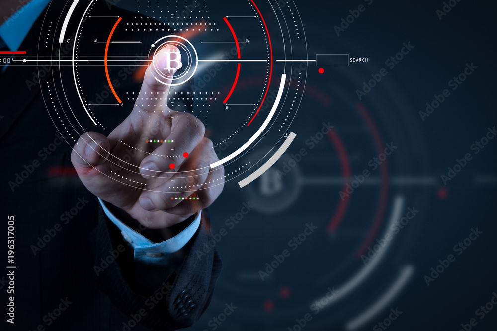 Fototapeta premium Businessman working with new modern computer and Bitcoin cryptocurry virtual diagram as concept.