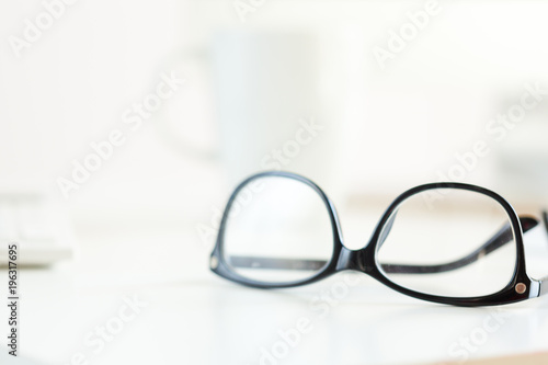 Eyeglasses on white table
