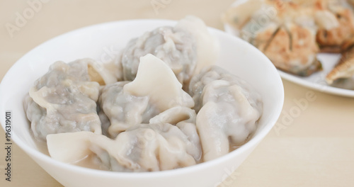 Eating chinese soup meat dumpling