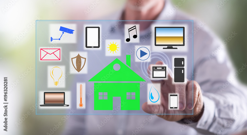 Man touching a smart home concept on a touch screen Man touching a smart home concept on a touch screen