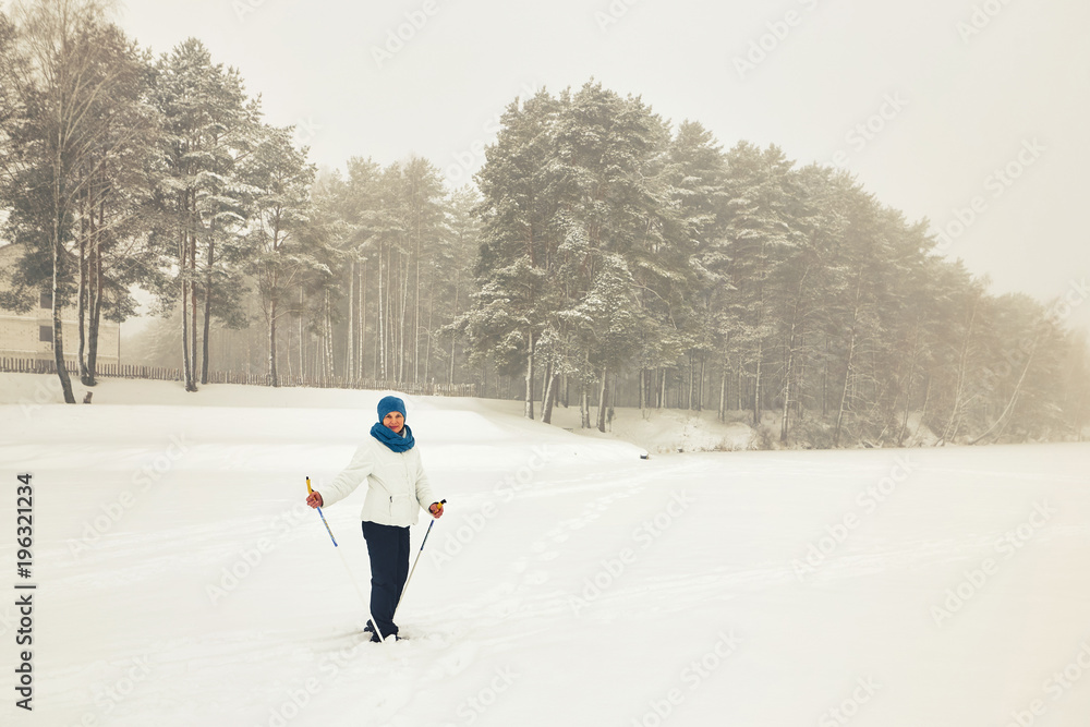 Belarus, Grodno, Lake Molochnoe in the winter. People skiing.