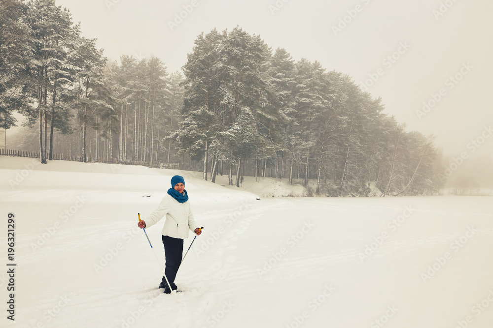 Belarus, Grodno, Lake Molochnoe in the winter. People skiing.