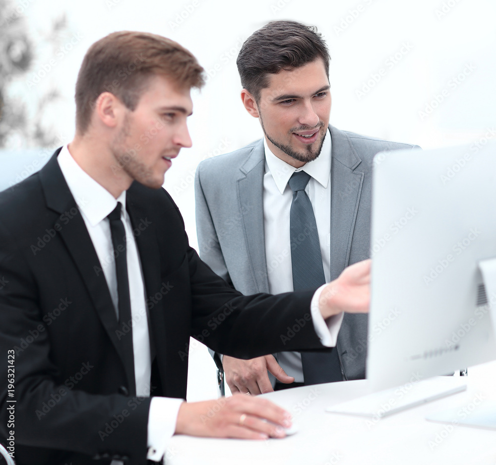 employees are talking sitting behind a Desk employees are talking sitting behind a Desk