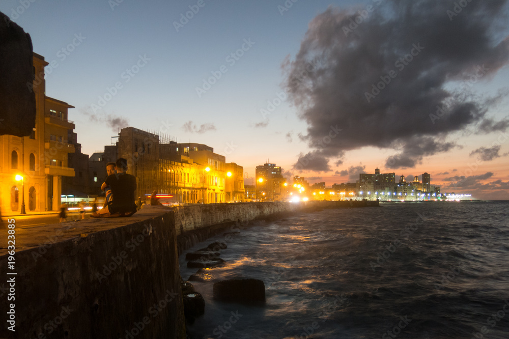 Sunset at Malecon, the famous Havana promenades. Cuba. At the bottom of the image, the National Hotel.