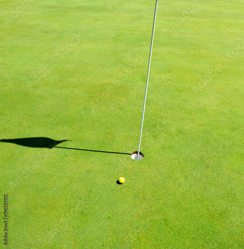 Ball on the green, golf course in Andalusia, golf in Spain