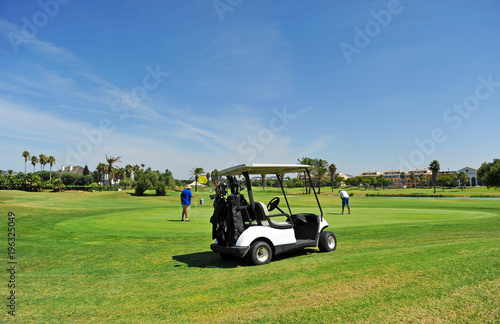 Golfers and buggy in Costa Ballena Golf course, Rota, Costa de la Luz Cadiz, Andalucia, South Spain