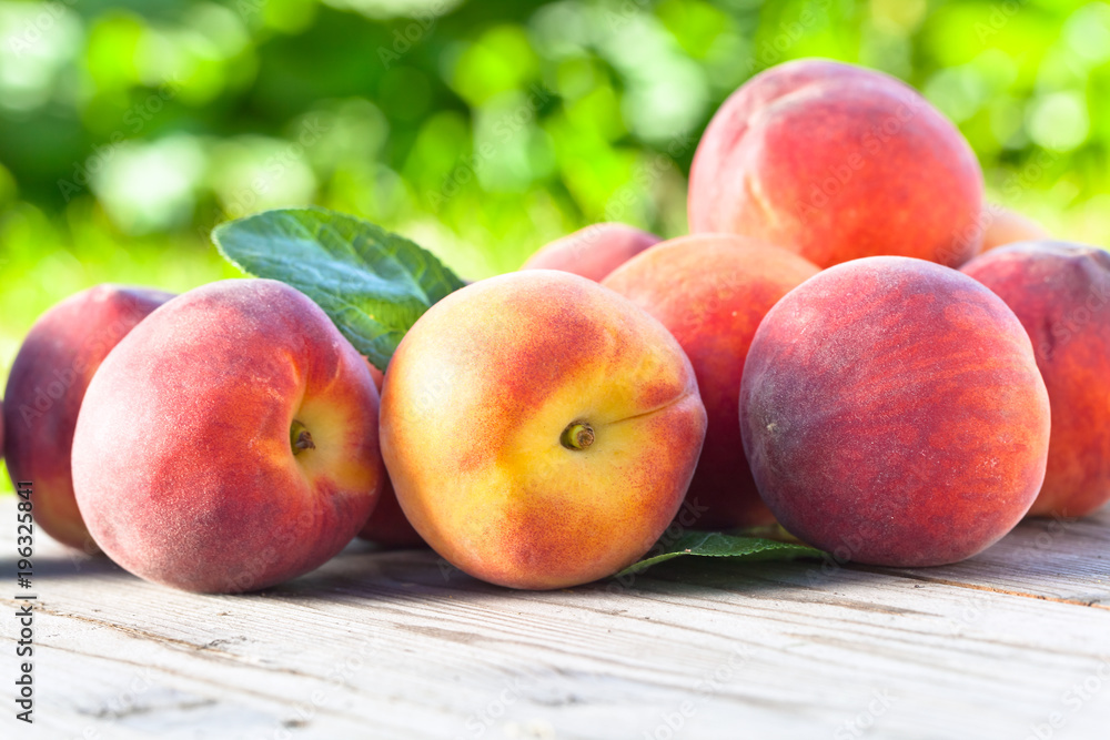 Juicy peaches on wooden table. Juicy peaches on wooden table.