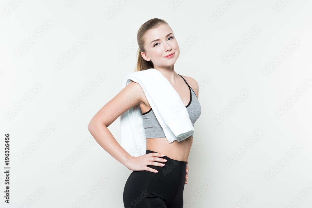 Young girl with towel on shoulder isolated on white Young girl with towel on shoulder isolated on white