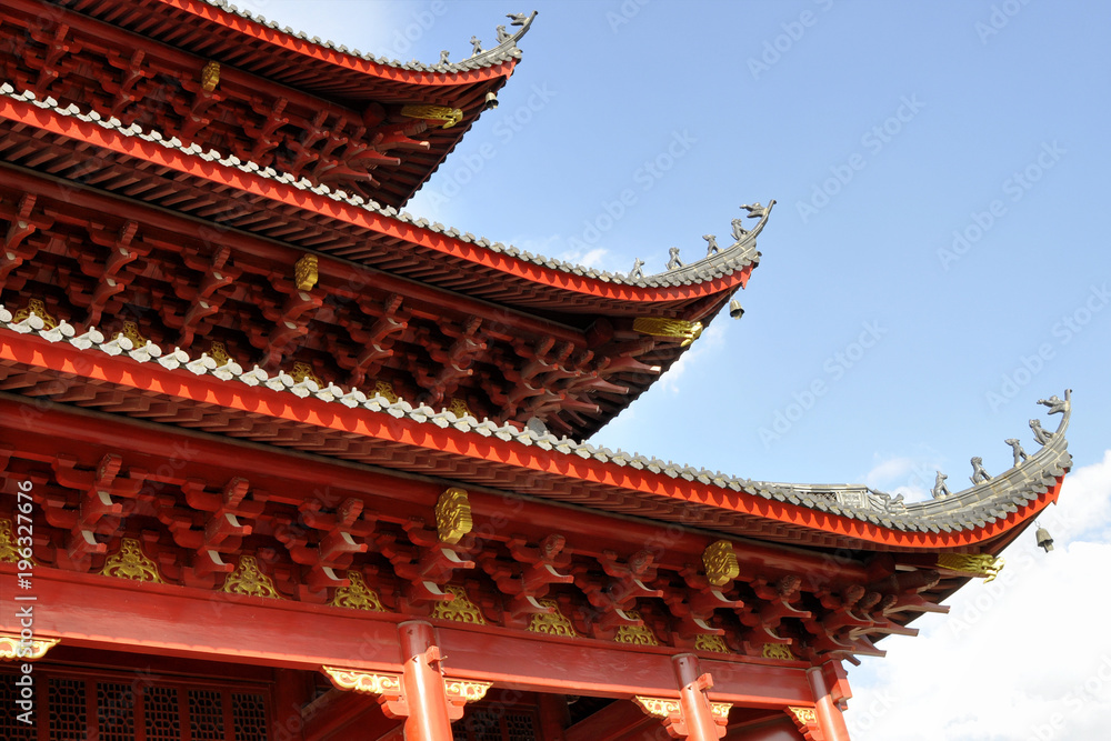 Chinese style temple roof against blue sky background Chinese style temple roof against blue sky background