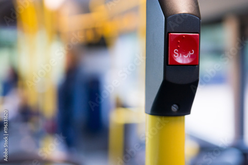 Public transport, inside a bus with stop button and people travelling in the city