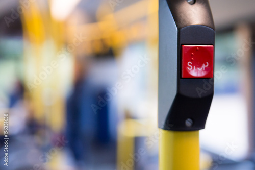 Public transport, inside a bus with stop button and people travelling in the city