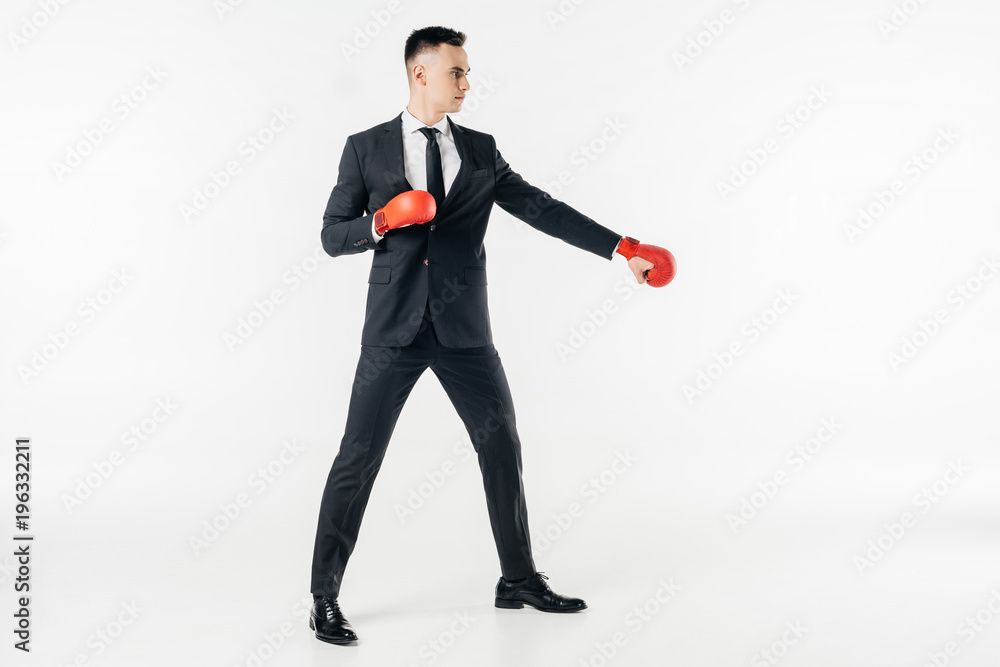 businessman in suit and red gloves isolated on white businessman in suit and red gloves isolated on white
