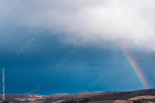 rainbow over rural fields
