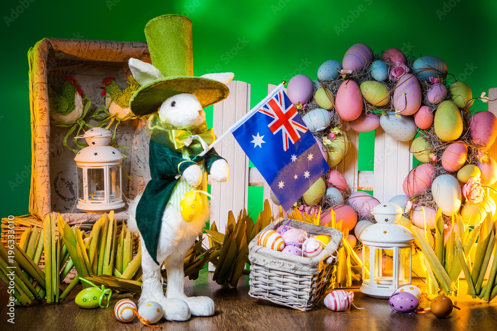 The Feast of Easter. Rabbit with colorful eggs. Holiday of Easter in Australia. A flag of 