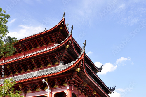 Chinese style temple roof against blue sky background