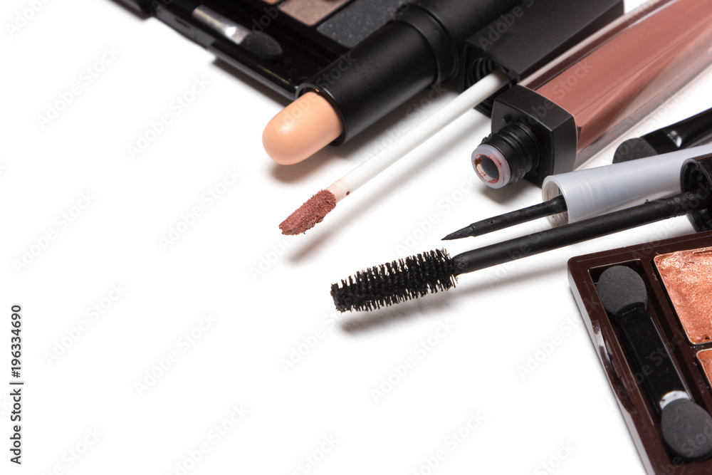 Beauty products for natural day makeup on white with copy space Beauty products for natural day makeup on white with copy space