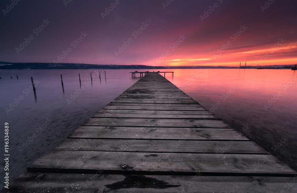 Colors of sunset and the old rusty pier