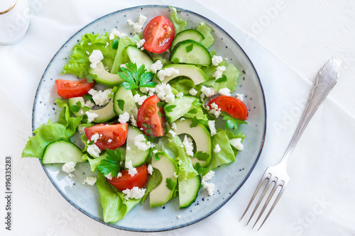 Avocado, feta and vegetables salad