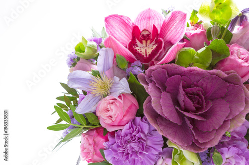 Bright buketny composition from fresh flowers  the white isolated background