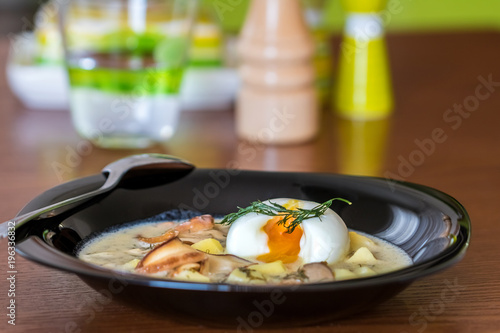 Traditional Czech cream cheese soup with mushrooms and egg