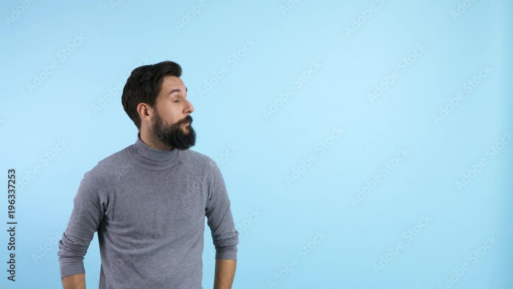 Handsome man pointing at copy space Handsome man pointing at copy space