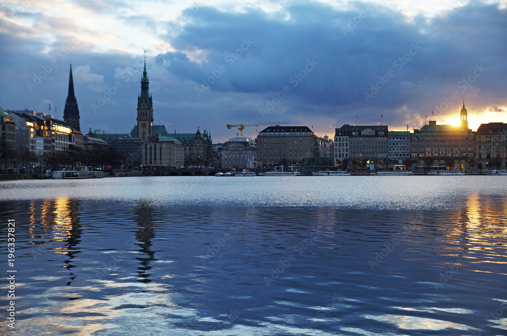 Lake Alster in Hamburg. View of the town hall. View of the city from the Alster lake. City center. The German landscape.