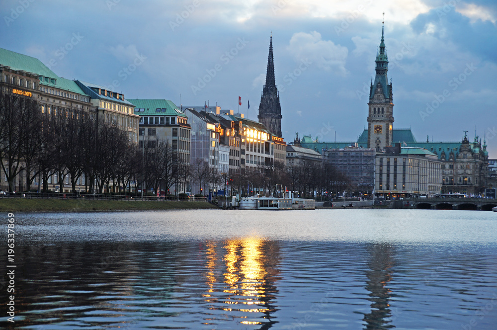 Lake Alster in Hamburg. View of the town hall. View of the city from the Alster lake. City center. The German landscape.