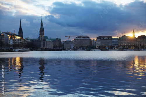 Lake Alster in Hamburg. View of the town hall. View of the city from the Alster lake. City center. The German landscape.