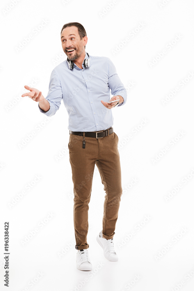 Full length portrait of a smiling mature man Full length portrait of a smiling mature man