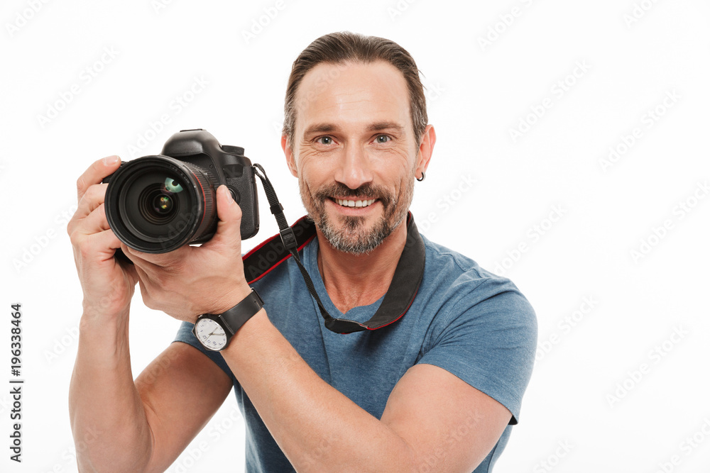 Portrait of a happy mature man dressed in t-shirt Portrait of a happy mature man dressed in t-shirt