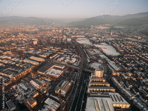 aerial view of rooftops with snow and streets at winter morning  Germany