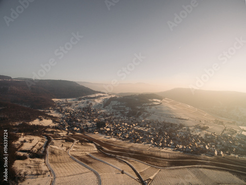 aerial view of beautiful snow-covered fields and village at winter morning  Germany