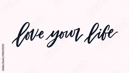 Love Your Life lettering or inscription handwritten with cursive calligraphic font