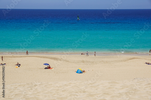 Sand dune and coastal promenade along a beach in Morro Jable town, Fuerteventura, Canary Islands, Spain © steuccio79