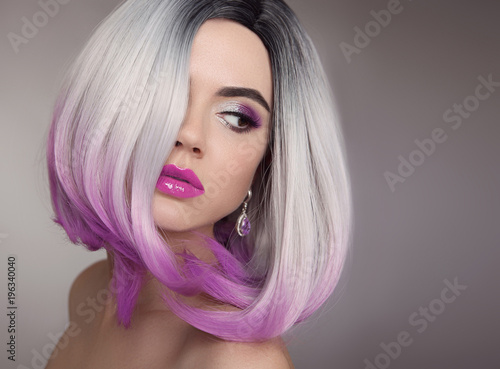 Ombre bob blonde short hairstyle. Purple makeup. Beautiful hair coloring woman. Fashion Trendy haircut. Blond model with short shiny hairstyle. Concept Coloring Hair. Beauty Salon.