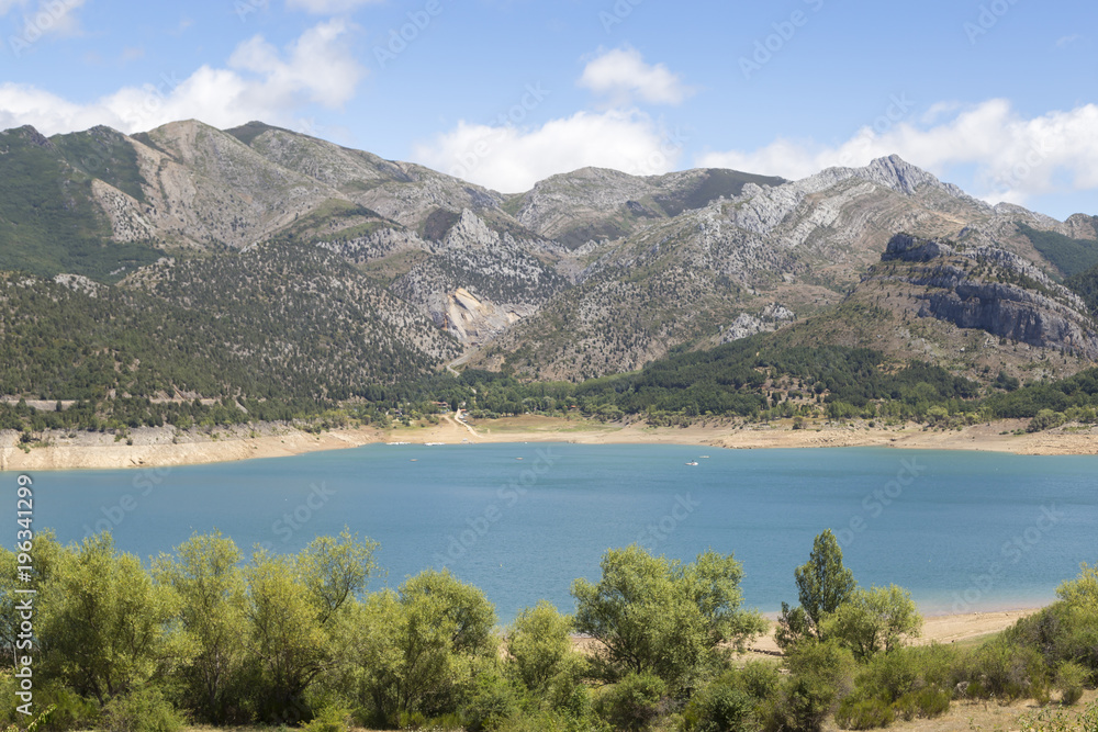 Lake with mountains in the background Lake with mountains in the background