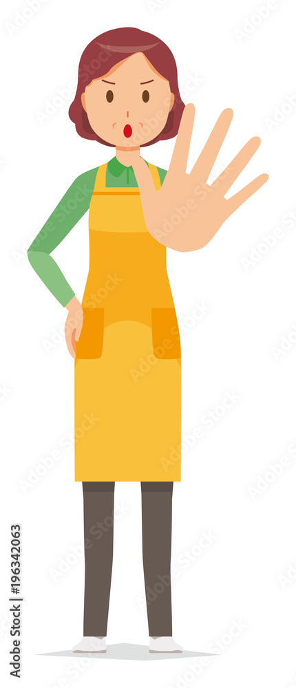 A middle-aged housewife wearing an apron is stop gesture A middle-aged housewife wearing an apron is stop gesture