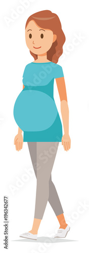A pregnant woman wearing green clothes is walking