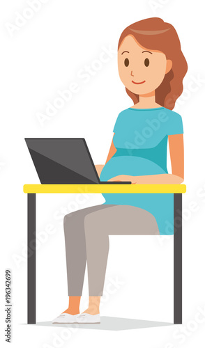 A pregnant woman wearing green clothes is operating a laptop computer