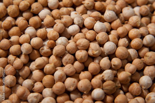 Chickpeas macro background. Turkish or garbanzo beans - healthy vegan food. Superfood with different vitamins. Close-up photo.