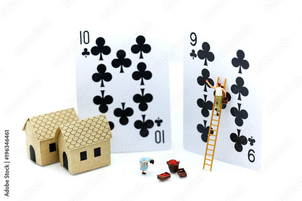 Miniature people : worker with playing card. - obrazy, fototapety, plakaty 