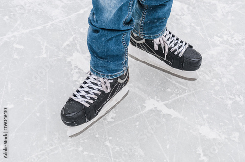 Man`s feet in skating rink