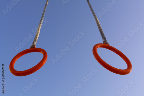 gymnastic rings on the background of the sky. photo