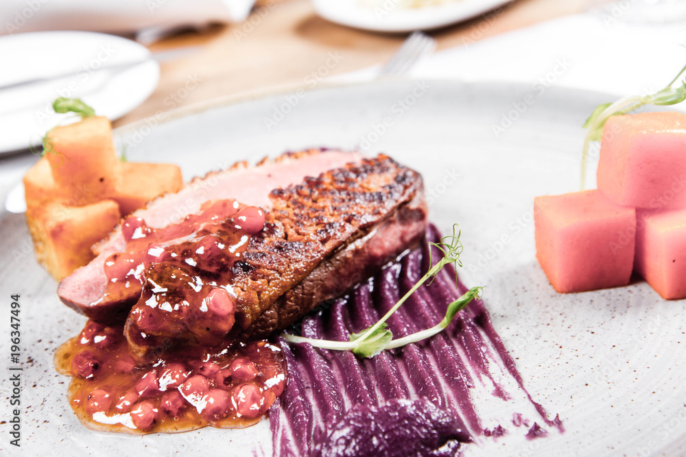 Roast duck breast, red cabbage with apple, roasted potatoes,mountain ash and honey sauce Roast duck breast, red cabbage with apple, roasted potatoes,mountain ash and honey sauce