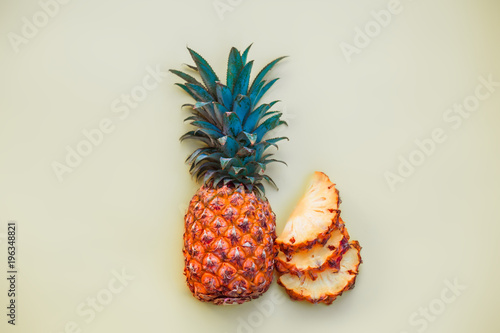 sliced pineapple on a light colored background